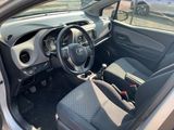 the interior of a small car with a steering wheel and dashboard