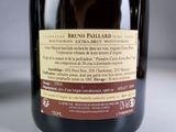 a bottle of wine sitting on a table with a label on it