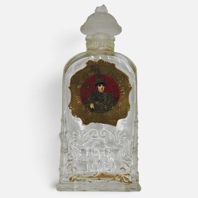 a glass bottle with a picture of a woman inside of it