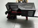 a table that has a tool on it in a garage