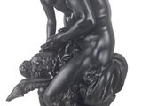 statue of a man and a woman sitting on a tree stump