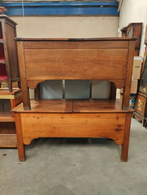 a wooden bench that is in the middle of a room