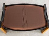 a brown and black chair with a brown seat cushion
