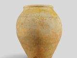 a large clay vase with a brown lid