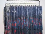 a picture of a rack with clothes on it in a room