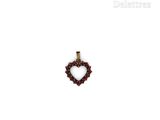 a close up of a heart shaped pendant on a white background