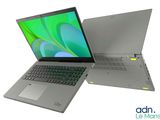 two open laptop computers sitting side by side on a white surface