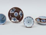 three small blue and white bowls and a small bowl and a small bowl
