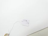 un bout de papier sur lequel est inscrit un prix et une paire de ciseaux