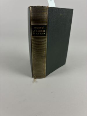 a black book sitting on top of a white table