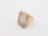 a close up of a ring with a stone in the middle