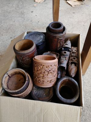 a cardboard box filled with different types of vases