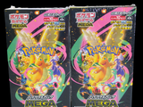 two packs of pokemon trading cards are shown on a black background