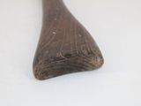 a wooden spoon that is sitting on a table