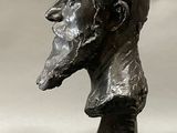 a statue of a man with a beard on a pedestal