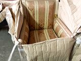 a chair that has been wrapped up and is sitting on the floor