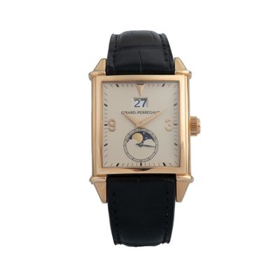 an image of a gold wrist watch with a black leather strap