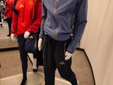 two mannequins dressed in sports clothing in a store