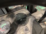 a close up view of a motorcycle dashboard with a gauge