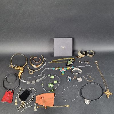 a group of assorted jewelry including bracelets, rings, and necklaces
