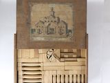 une boîte en bois contenant l'image d'un bâtiment