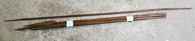 two sticks that are sitting on a table
