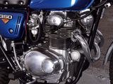 a blue motorcycle that is parked in a garage