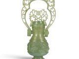 an image of a green vase sitting on top of a white surface