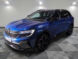 a blue suv parked on a checkered floor in a garage