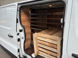 a white van with a wooden crate in the back