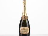 a bottle of champagne sitting on top of a table