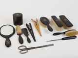 many different types of hair brushes and combs on the table