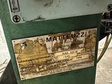 a machine that is sitting on the ground with a label on it