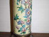 a vase that has flowers on it on a table