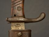 a close up of a knife with a metal handle