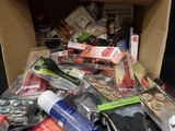 a cardboard box filled with assorted items in it