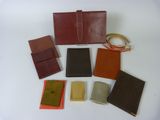 several pieces of leather are laid out on a white surface