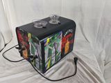 a black suitcase with a design on it sitting on a white sheet