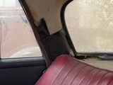 an image of a dirty car seat with a dirty window