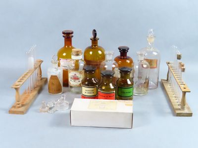 many bottles and a box of medicine on a table