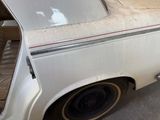 a white van parked in a parking lot with its door open