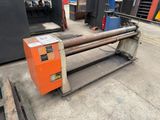 a machine that is sitting on the ground in a warehouse