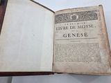 a book open on a table with a white background