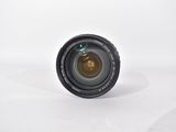 a close up of a camera lens on a white surface