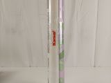 a tube of toothpaste next to a toothbrush on a white surface
