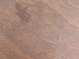 a close up view of a wooden table with a knife and fork