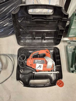 a black and decker tool box with tools in it
