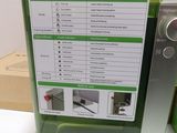 a green box with instructions on it sitting on a table