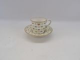 tea cup and saucer with a floral design on a white background