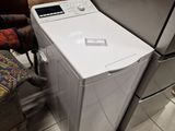 a white washer and dryer sitting next to each other in a room